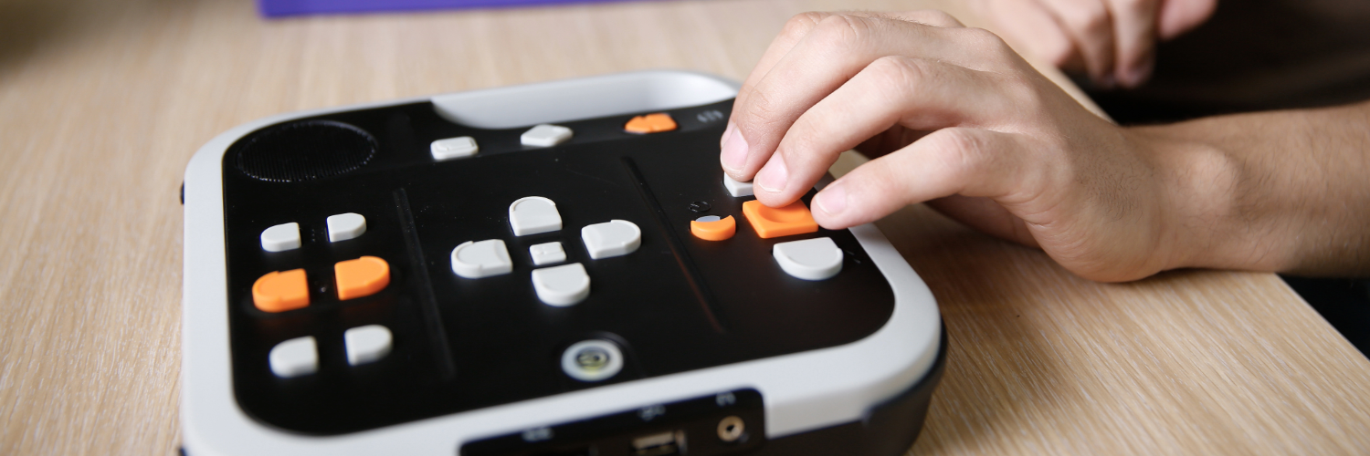 A hand using a screen reader