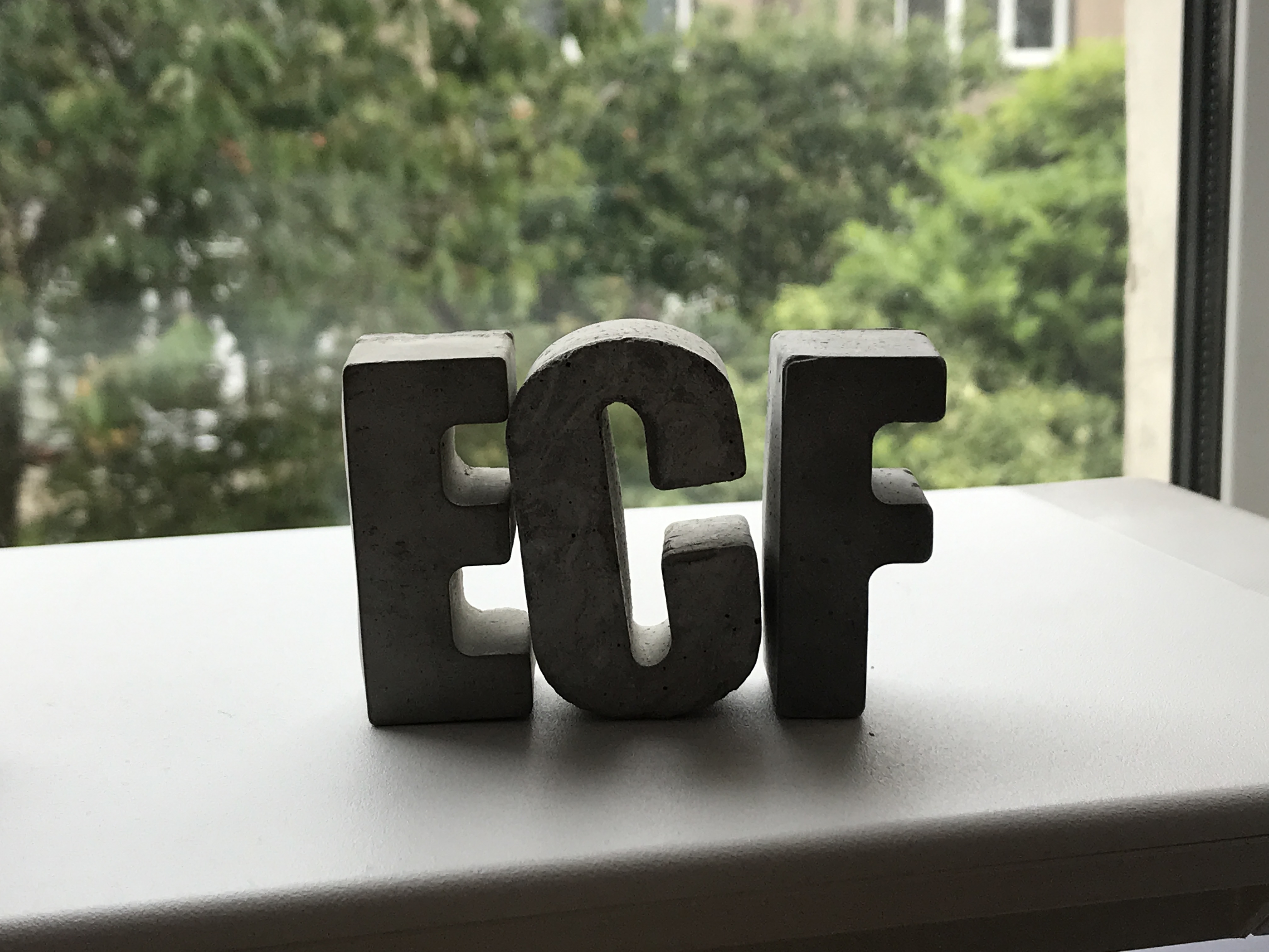 Models of the letters E, C, and F, standing on a windowsill. ECF is an acronym for Early Career Framework.