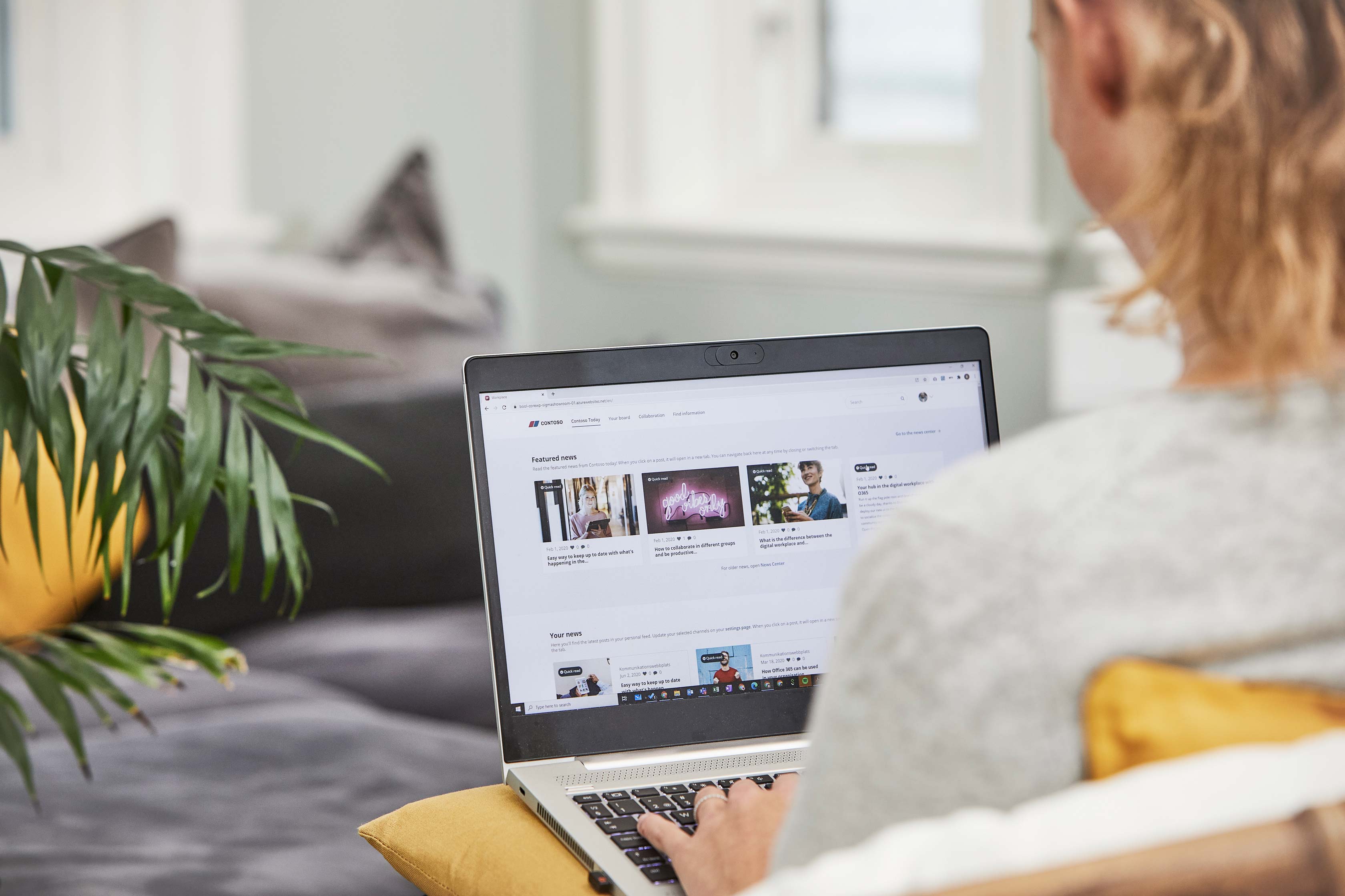 Looking over the shoulder of a person who is using our intranet solution on their laptop. 