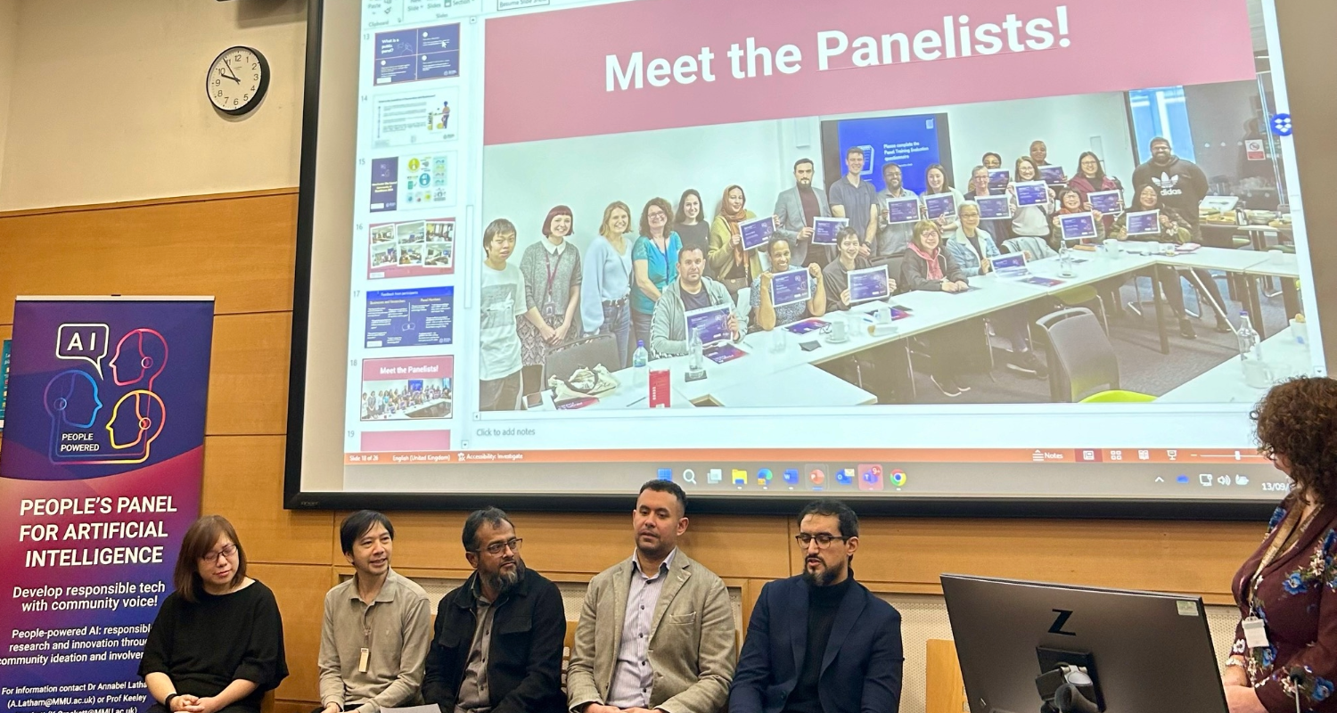 The panelists for the Peope's Panel for AI review event, seated in a row. Behind them is a slide reading "Meet the panelists"