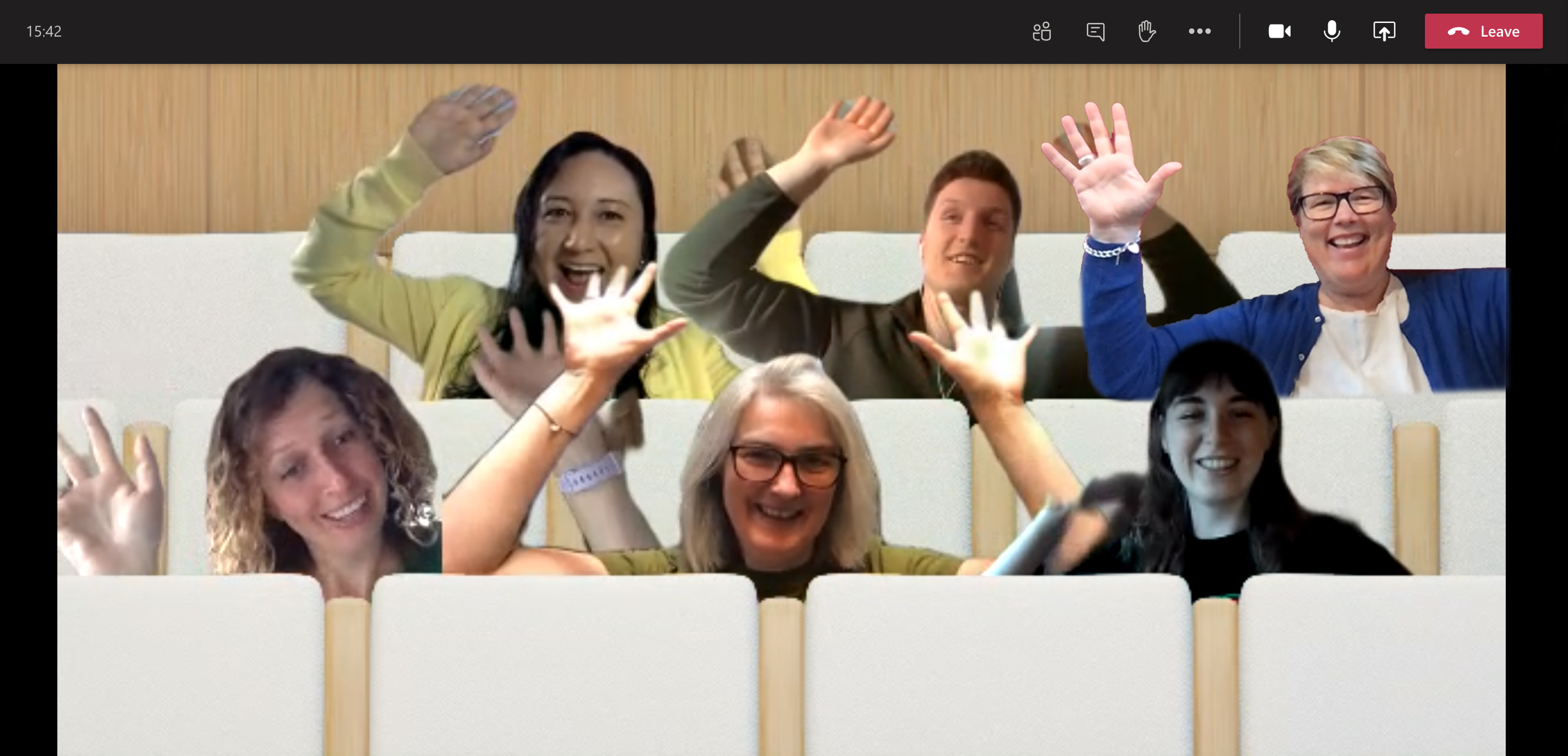Six new team members in a screenshot from Microsoft Teams. They are waving thier hands in the air and laughing