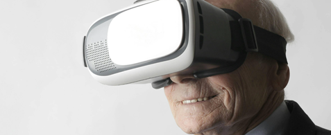 An image of an older person wearing a VR headset