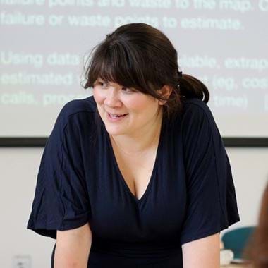 Headshot of Camp Digital speaker Clara Greo. Clara has brown hair in a ponytail with a fringe, and brown eyes.